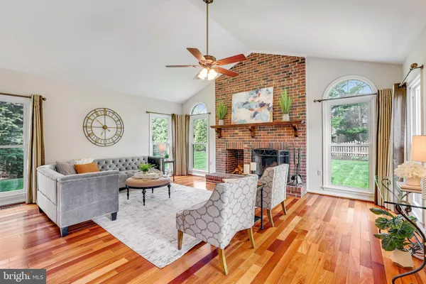 a bathroom with a granite countertop sink a toilet and bathtub
