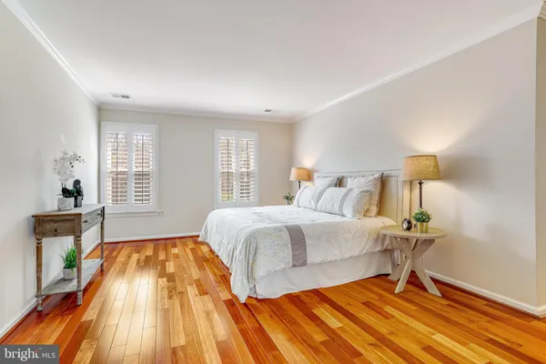 an empty room with a ceiling fan and window