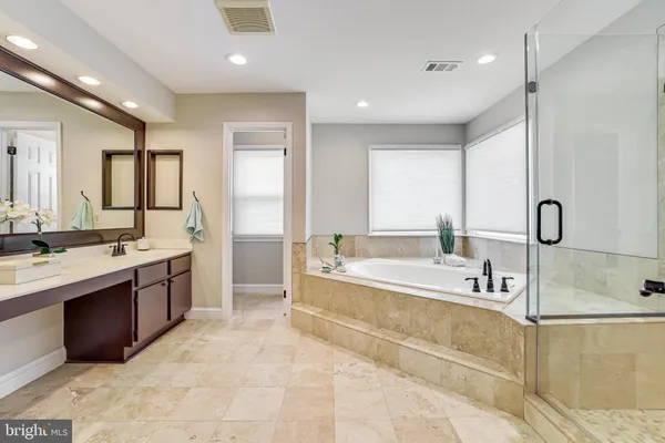 a yellow house in middle of the garden