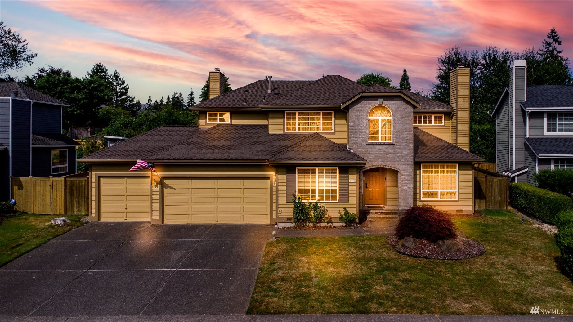 1807 Field Avenue Northeast Renton, WA 98059 - Photo 1 of 38 a front view of a house with a yard