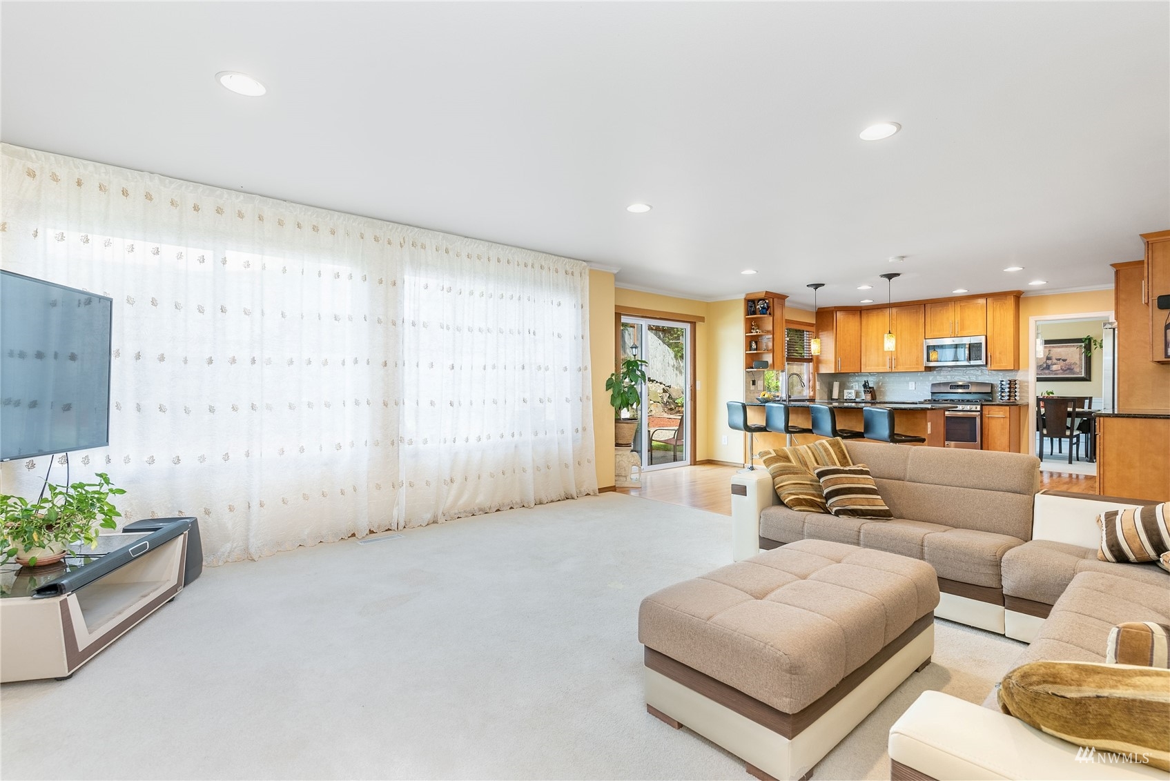 1807 Field Avenue Northeast Renton, WA 98059 - Photo 19 of 38 a living room with furniture and a large window