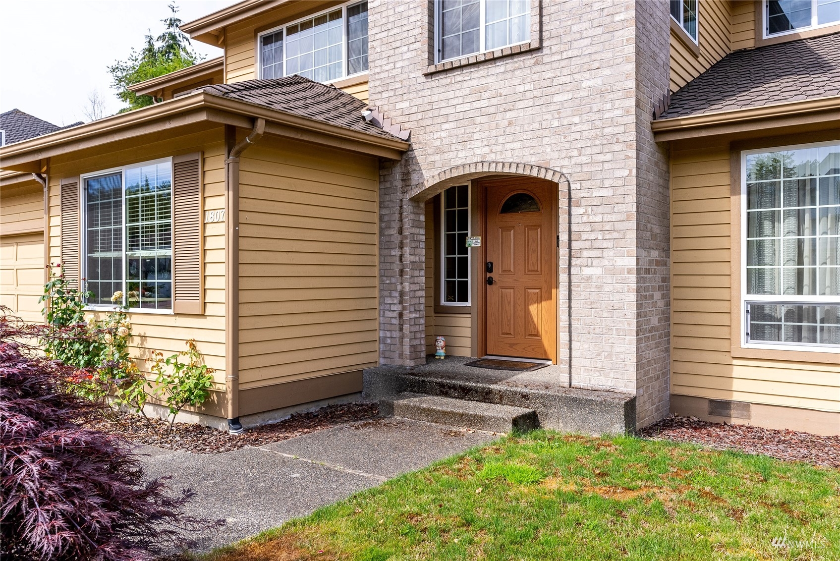 1807 Field Avenue Northeast Renton, WA 98059 - Photo 2 of 38 a front view of a house with garden