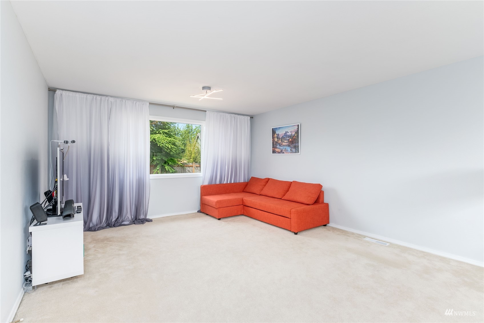 1807 Field Avenue Northeast Renton, WA 98059 - Photo 24 of 38 a spacious bedroom with a bed and a window