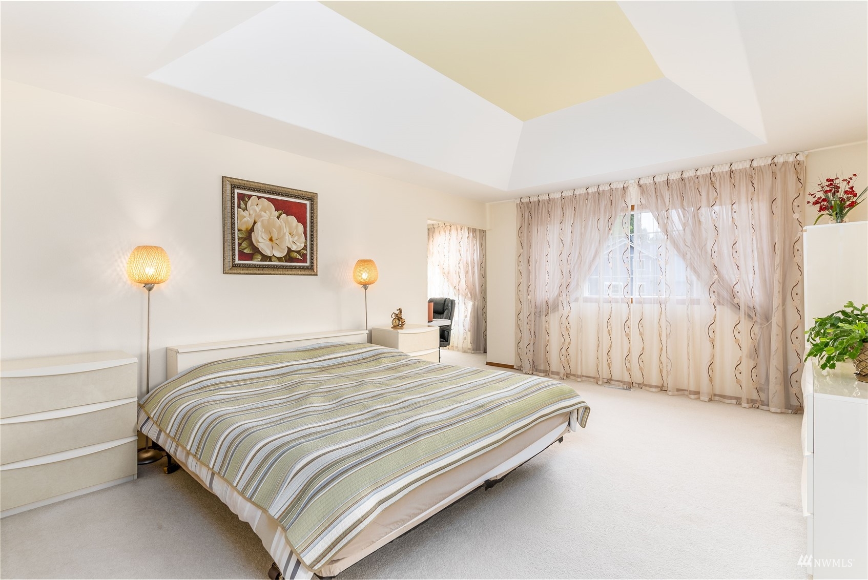 1807 Field Avenue Northeast Renton, WA 98059 - Photo 26 of 38 a bedroom with a bed and a painting on the wall