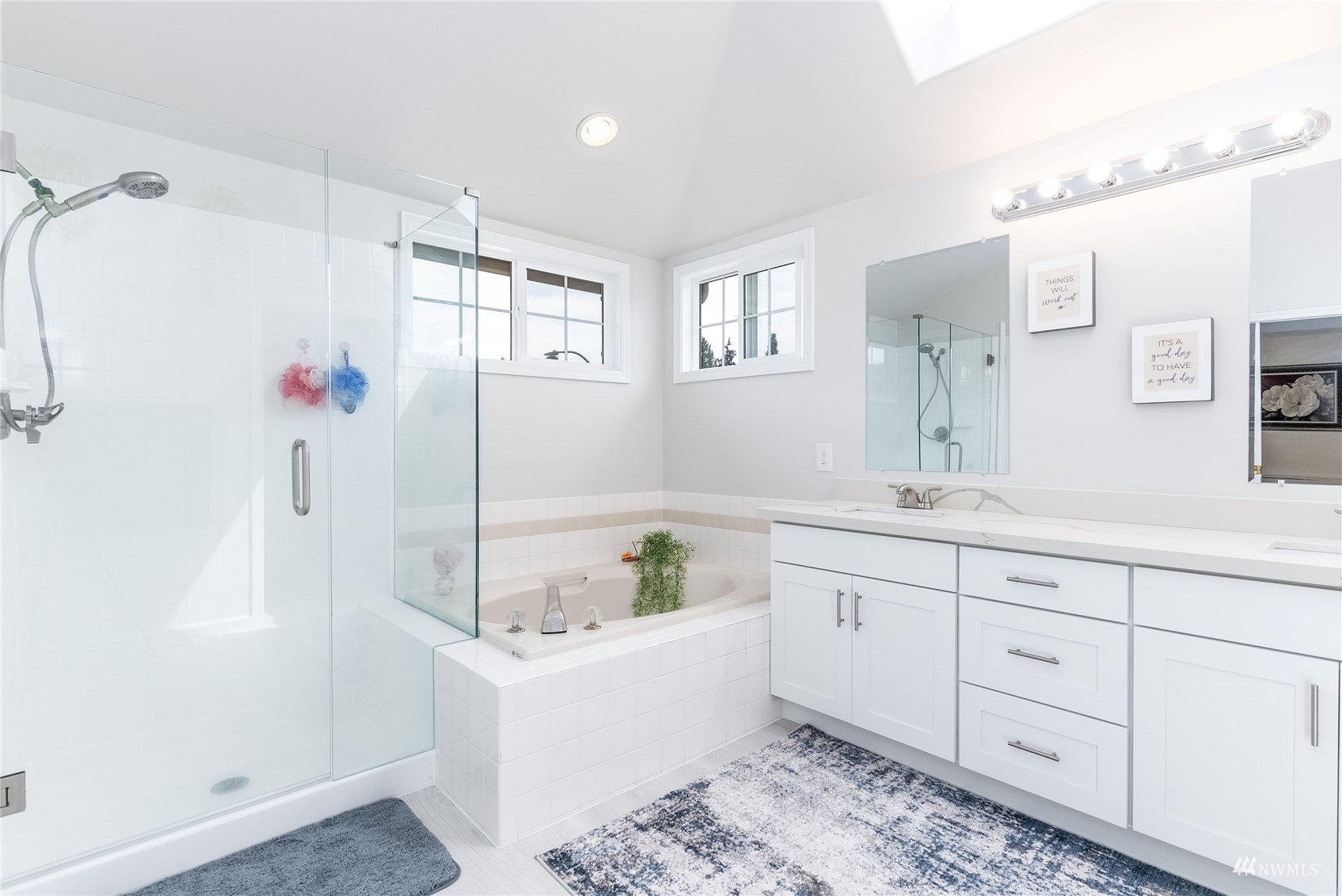 1807 Field Avenue Northeast Renton, WA 98059 - Photo 29 of 38 a bathroom with a tub sink and mirror