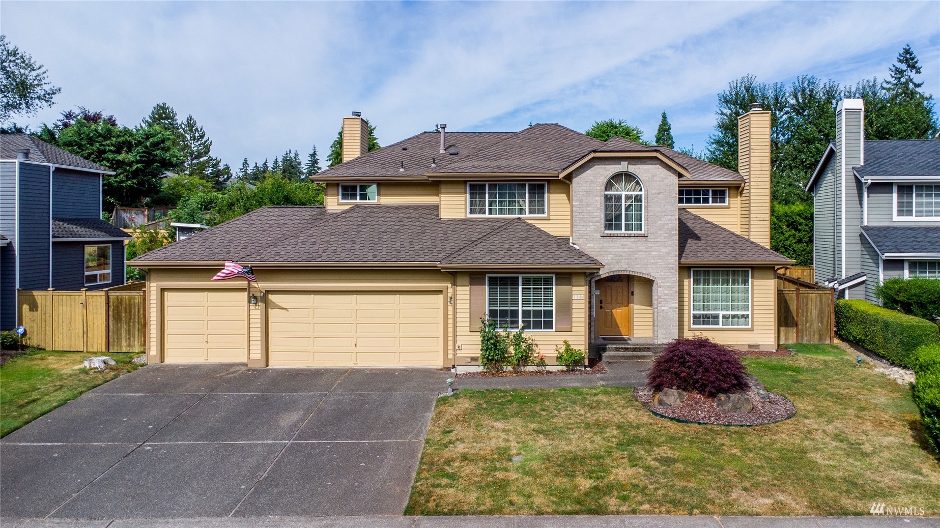 1807 Field Avenue Northeast Renton, WA 98059 - Photo 3 of 38 a front view of a house with a yard