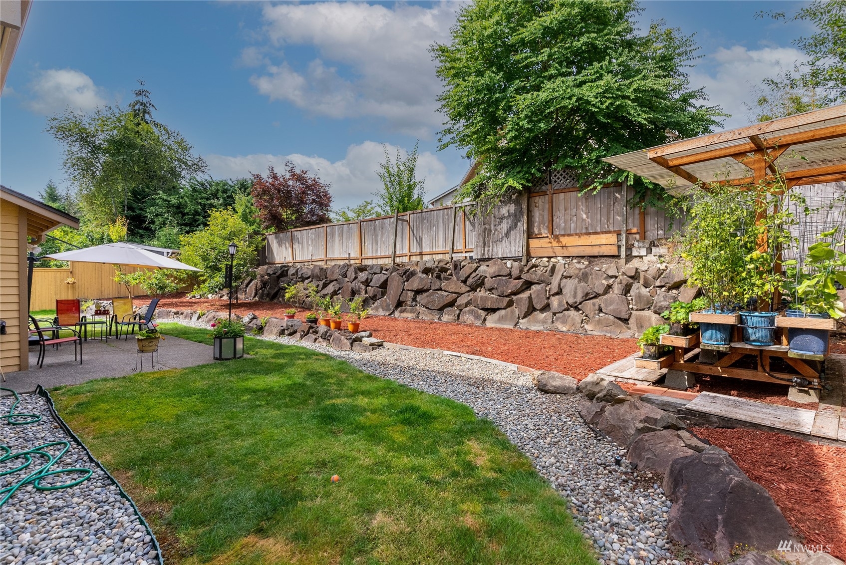 1807 Field Avenue Northeast Renton, WA 98059 - Photo 7 of 38 a view of a backyard with sitting area