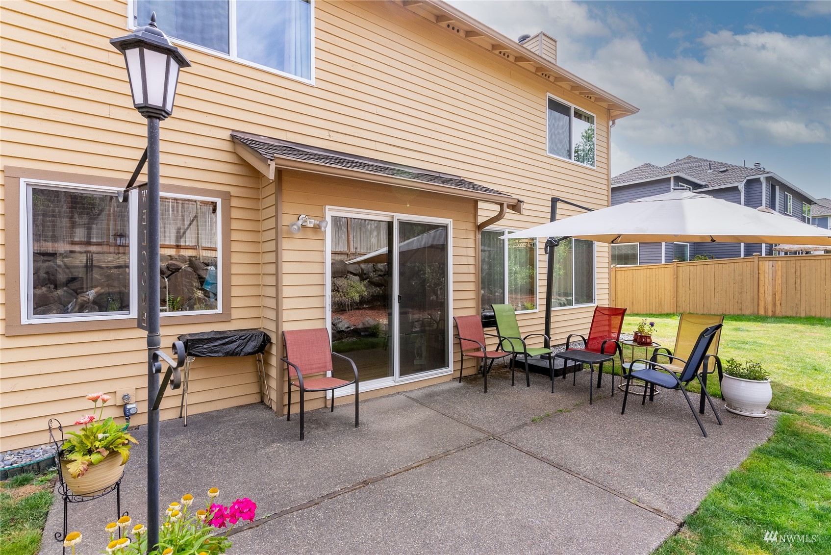 1807 Field Avenue Northeast Renton, WA 98059 - Photo 8 of 38 a backyard of a house with yard and outdoor seating