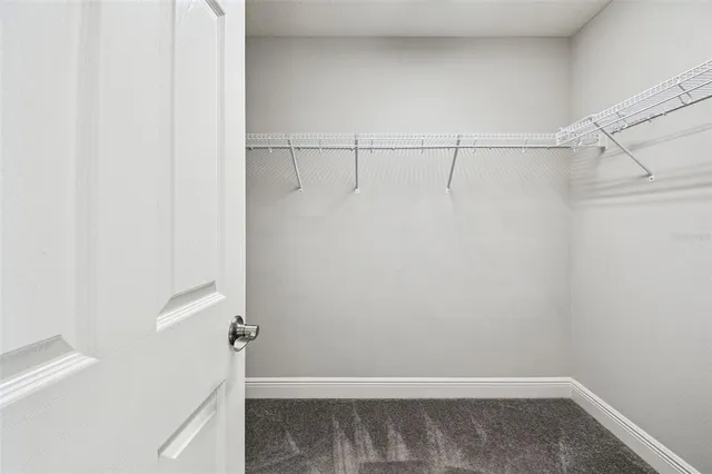 an aerial view of a house with garden space and sitting area