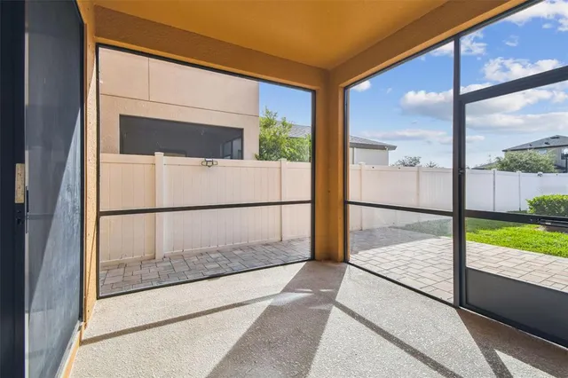 an aerial view of a house with a swimming pool and outdoor space