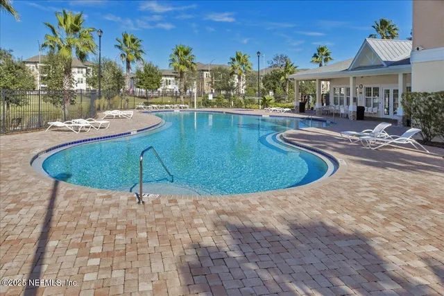 a view of a swimming pool with a patio