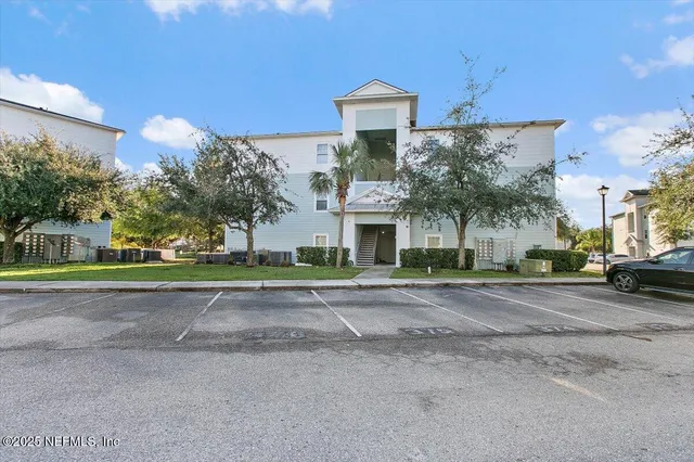 a view of a house with a yard and plants