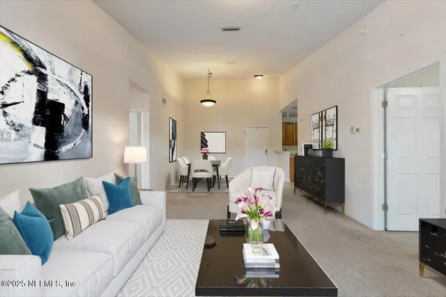 a living room with furniture and a rug
