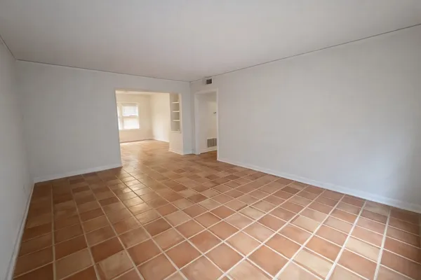 a view of an empty room and window