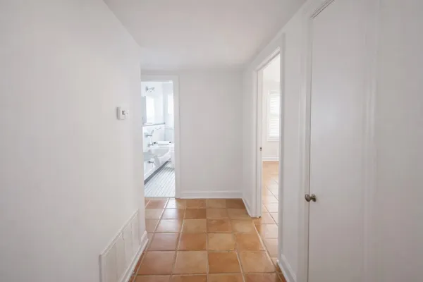 a view of an entryway with hallway