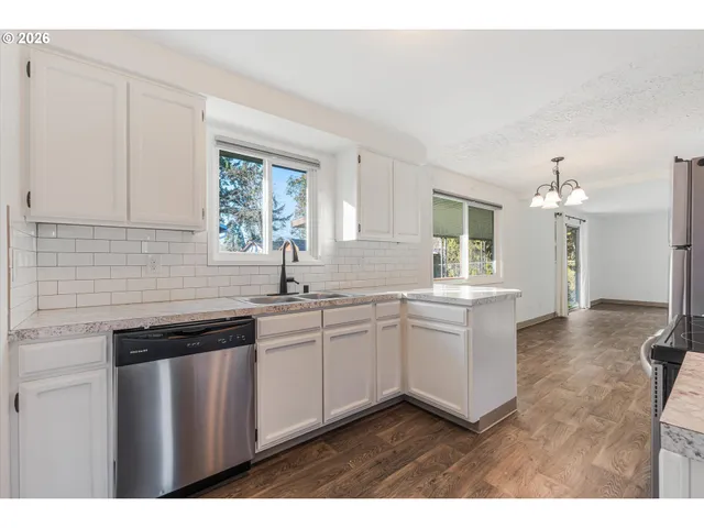 a kitchen with sink and cabinets
