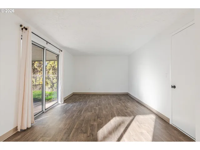 a view of an empty room and window