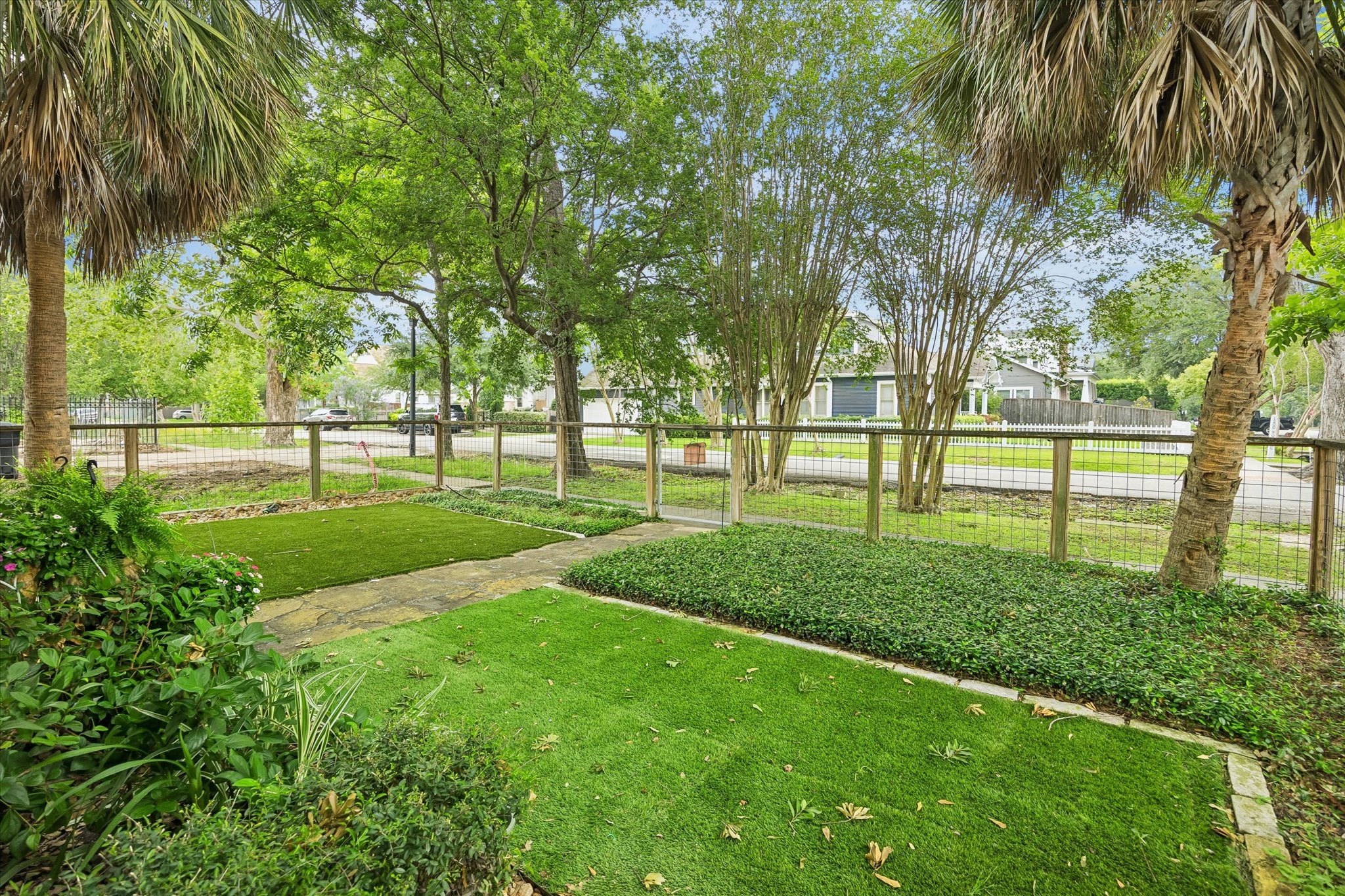 1201 Tulane Street Houston, TX 77008 - Photo 7 of 31 From the front porch, this peaceful garden setting gives you a front-row seat to mature trees, lush greenery, and classic Heights charm. It is the kind of spot that turns simple moments into something extraordinary.