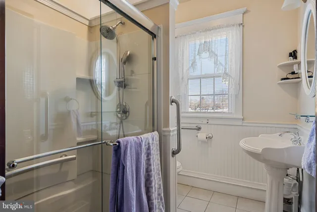 a bathroom with a sink and shower