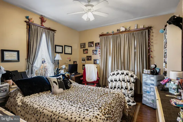 a bedroom with bed and a window