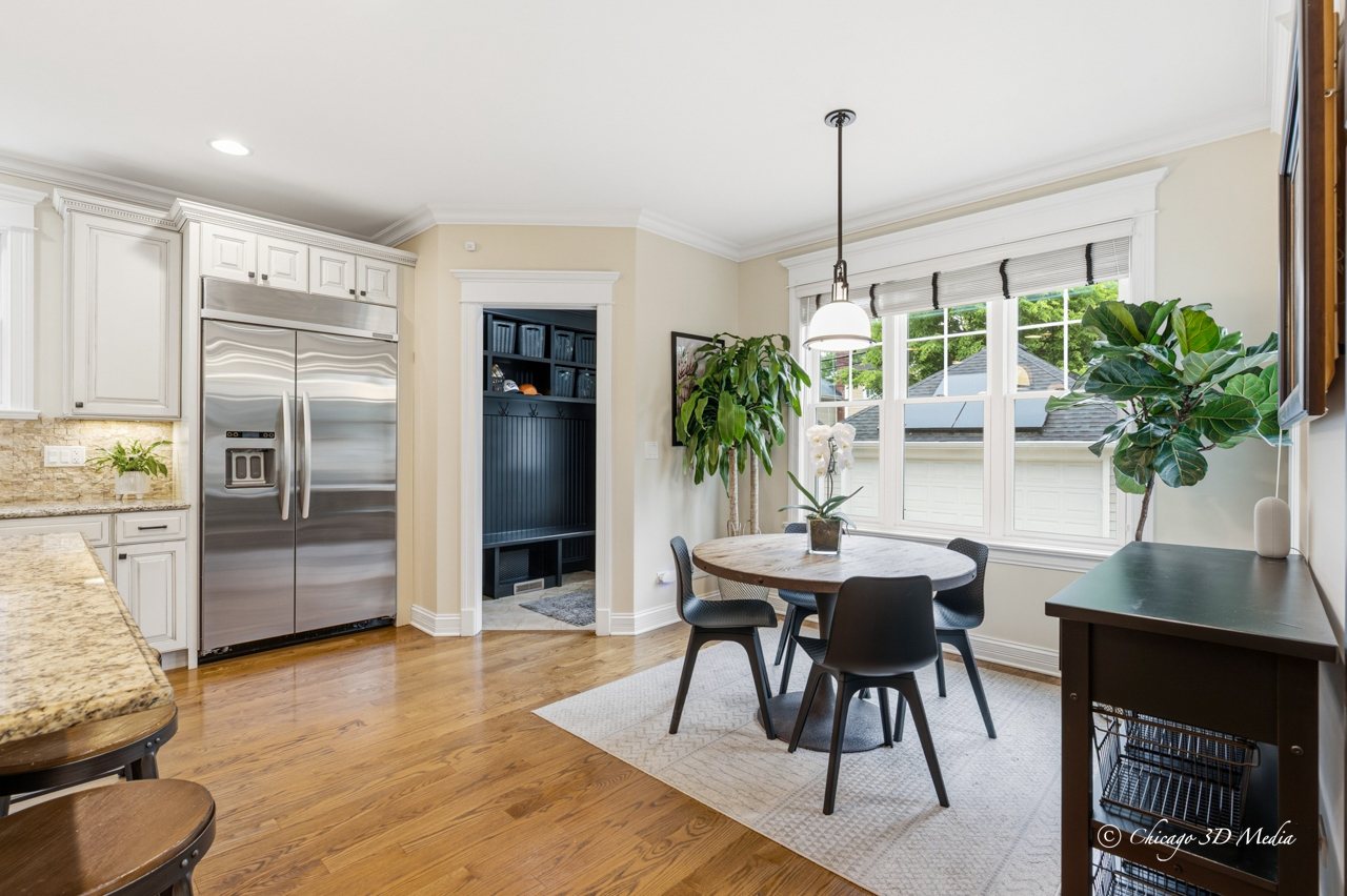 306 17th Street Wilmette, IL 60091 - Photo 19 of 48 a dining room with furniture and a chandelier