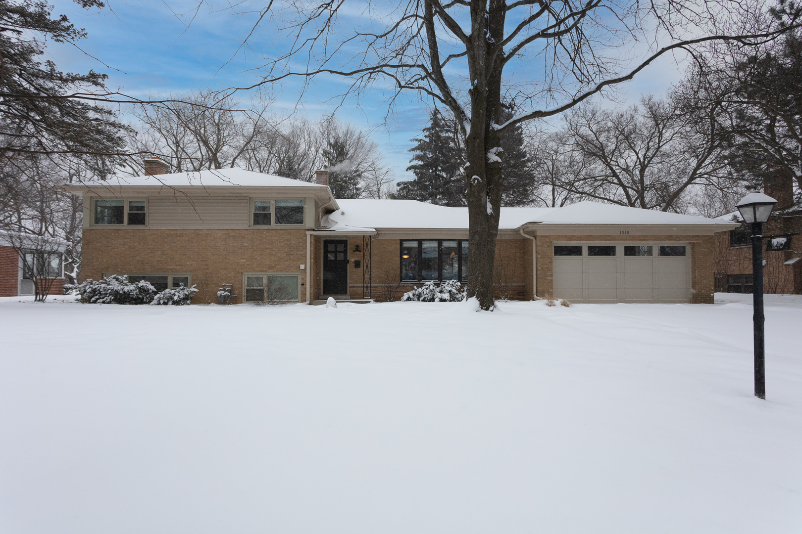 1215 Hillside Road Northbrook, IL 60062 - Photo 1 of 11 a front view of a house with a yard