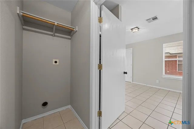 a kitchen with a sink a stove and cabinets