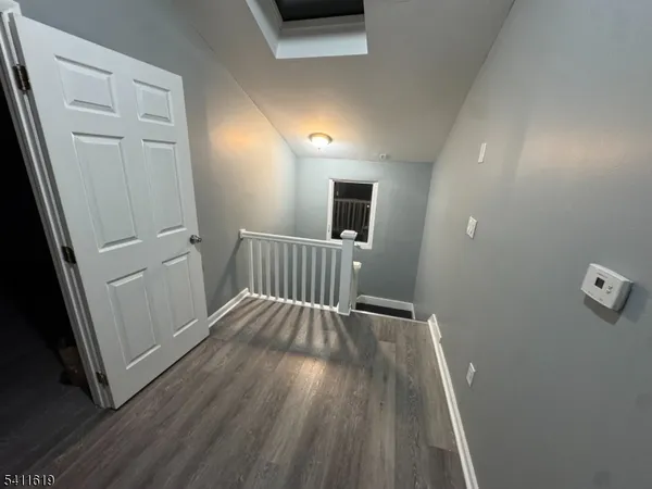 wooden floor in a hall with an entryway