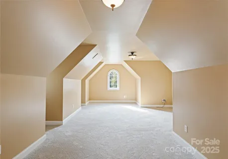 a view of a big room with closet and windows