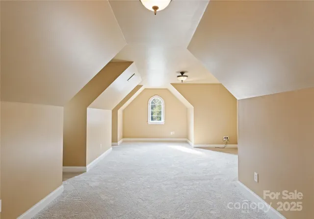 a view of a big room with closet and windows