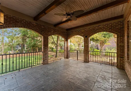 a view of a porch with wooden floor