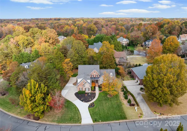 an aerial view of a house with outdoor space