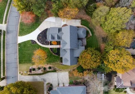 an aerial view of residential house with outdoor space and swimming pool