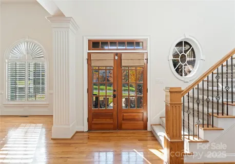 a view of front door with wooden floor