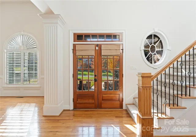 a view of front door with wooden floor