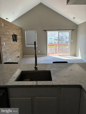 a kitchen with a sink and a window