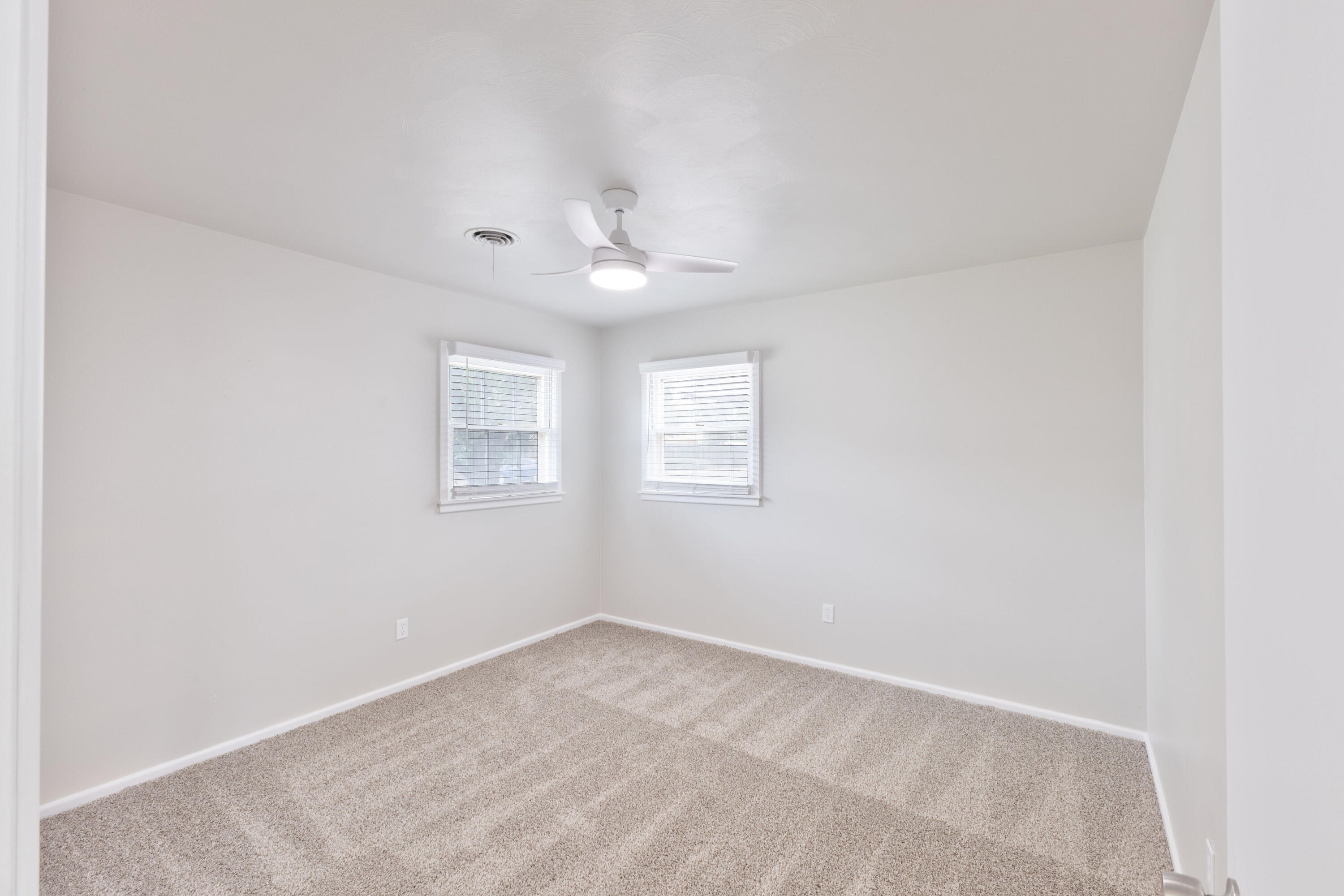 3417 52nd Street Lubbock, TX 79413 - Photo 13 of 19 an empty room with a window