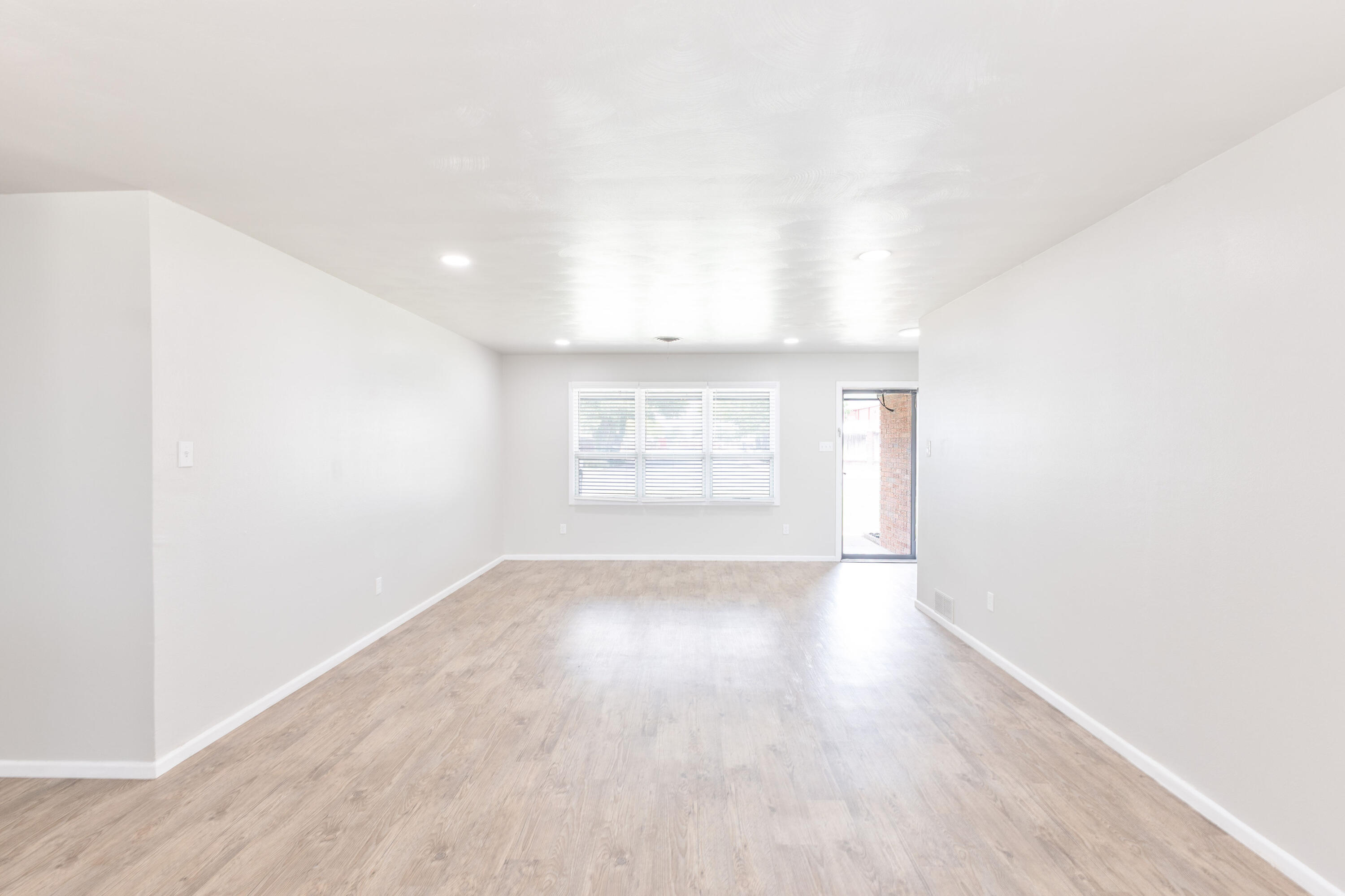3417 52nd Street Lubbock, TX 79413 - Photo 4 of 19 a view of an empty room and a window