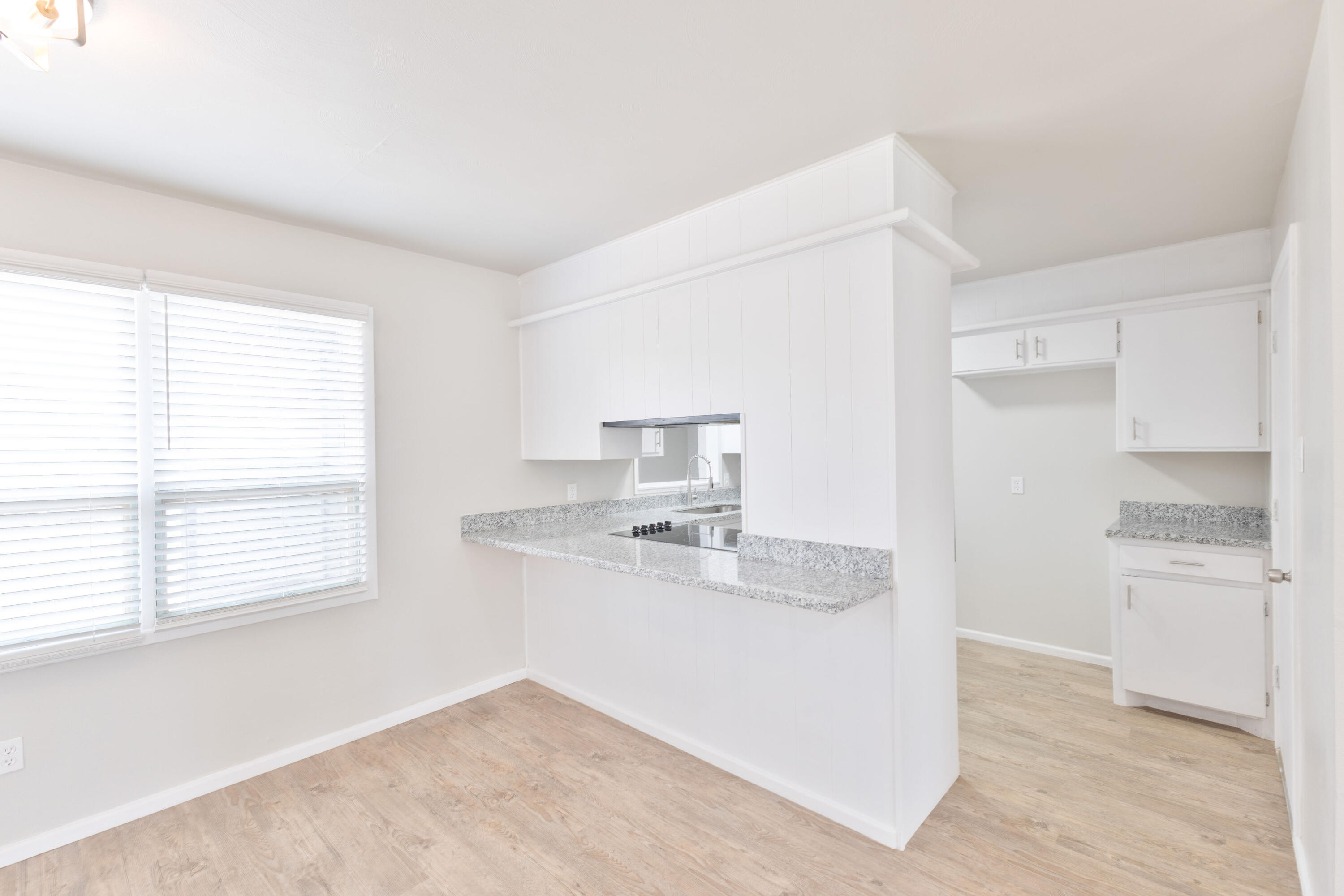 3417 52nd Street Lubbock, TX 79413 - Photo 9 of 19 a kitchen with a sink cabinets and window