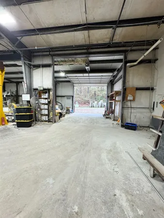 a view of parking garage with cars