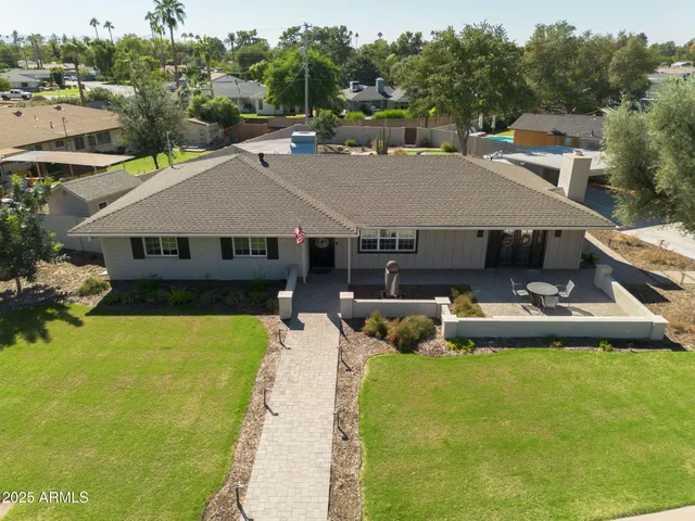 a aerial view of a house with swimming pool