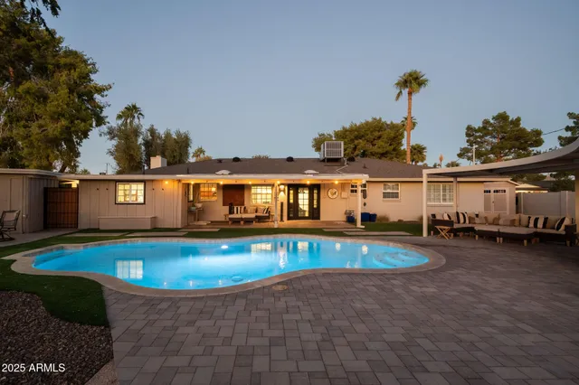 a view of a swimming pool with a patio