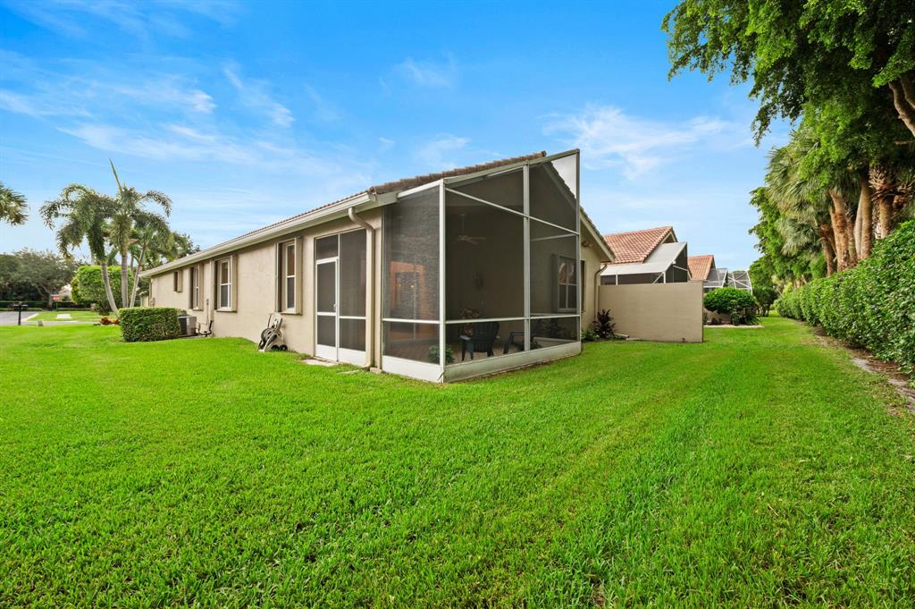 6710 Vía Roma Delray Beach, FL 33446 - Photo 21 of 35 a view of a house with backyard