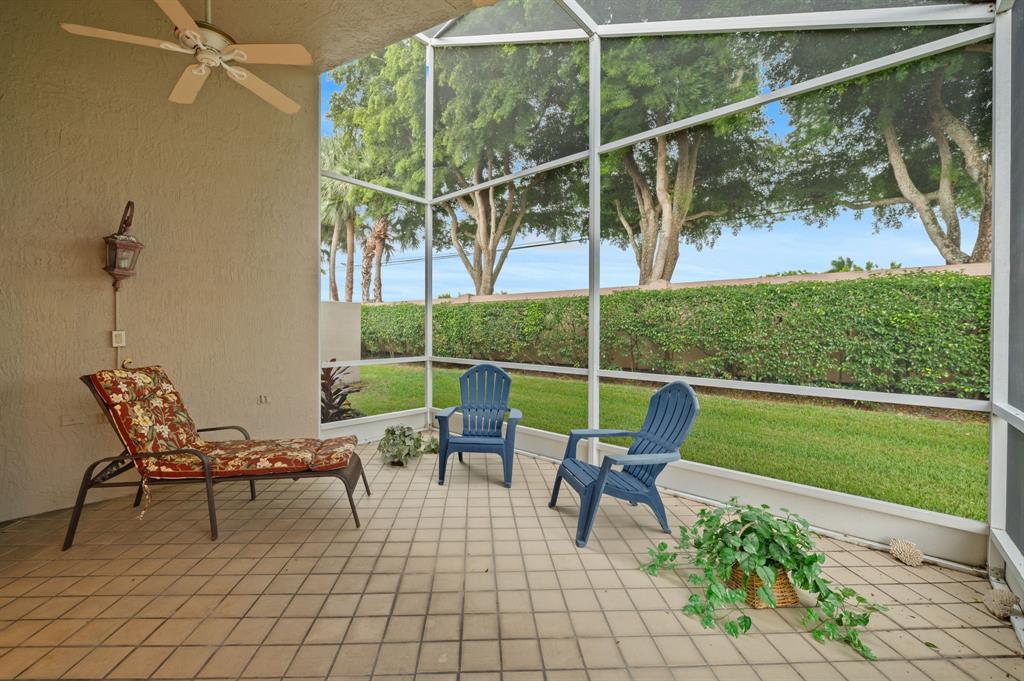 6710 Vía Roma Delray Beach, FL 33446 - Photo 23 of 35 a view of a chairs and table in the patio