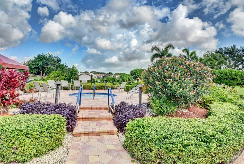 6710 Vía Roma Delray Beach, FL 33446 - Photo 28 of 35 a view of a pathway with flower plants