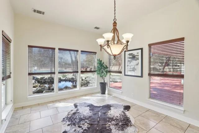 a view of entryway with window and wooden floor