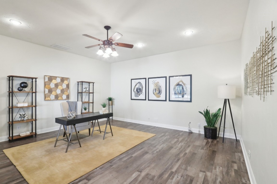 294 Logan Ranch Road Georgetown, TX 78628 - Photo 14 of 40 a living room with furniture and a wooden floor