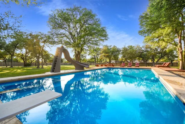 a view of a lake in a backyard