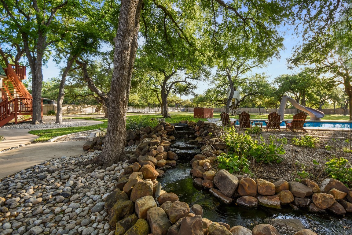 294 Logan Ranch Road Georgetown, TX 78628 - Photo 34 of 40 a view of a street with a tree