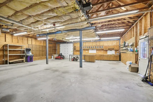 a view of a big room with wooden walls